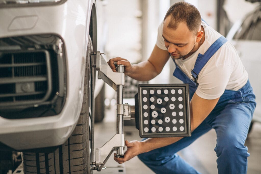 Auto mechanic tyre inspection